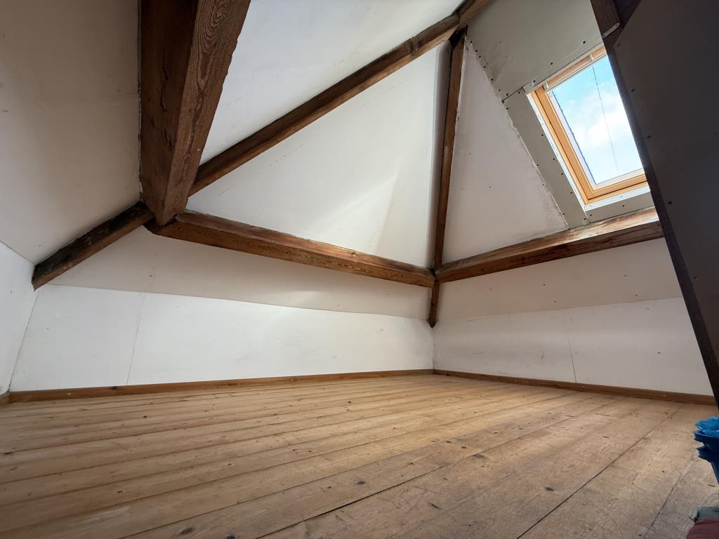 Lot: 125 - END-TERRACE TWO-BEDROOM HOUSE WITH REAR GARDEN FOR UPDATING - Part of the attic storage